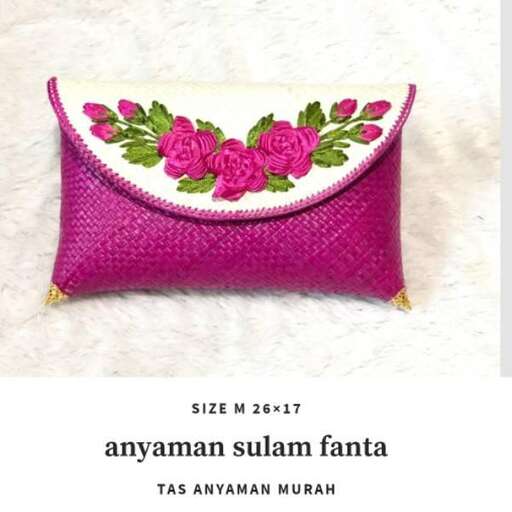 a small purse with roses on it.
