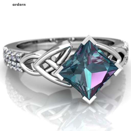a beautiful ring with a diamond and a round center stone.