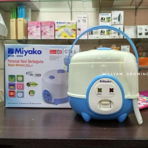 a blue and white microwave sitting on a table.