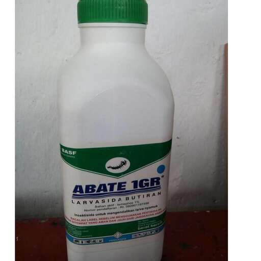 the bottle is a plastic bottle with a green label.