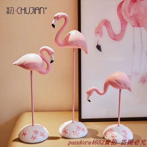 a collection of pink flamingos in a row.