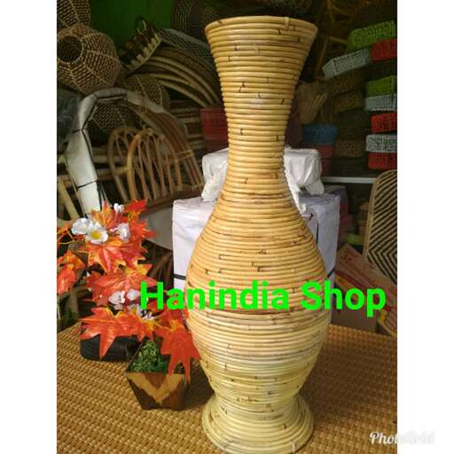 a large vase made of bamboo and a vase.