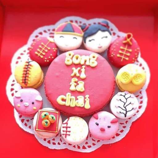 a cake decorated with various types of cupcakes.