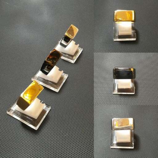 a set of three pieces of glass, with a black background.