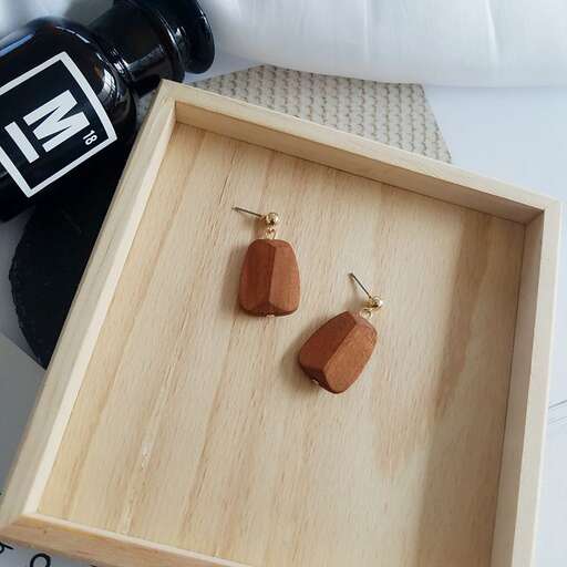 wooden box with glass beads in gold