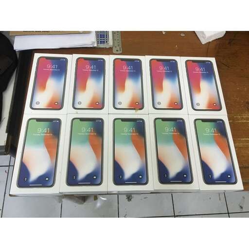 a table with a lot of cell phones on it