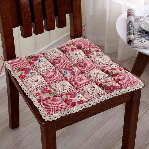 a pink and white quilted cushion.