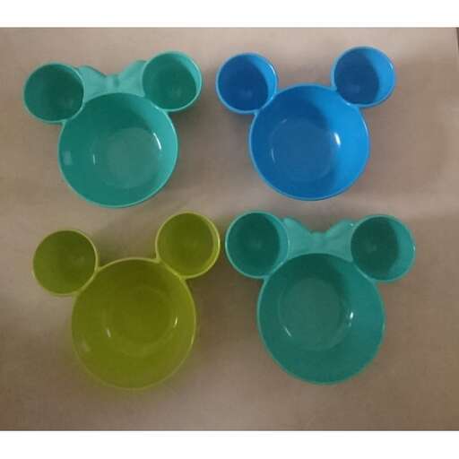 a close up of three cups and a mouse