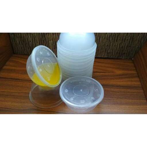 two plastic containers are sitting on a table.
