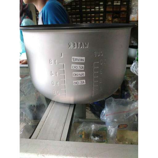 a large metal bowl sitting on top of a counter.
