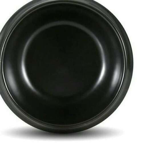 a black plate with a shadow