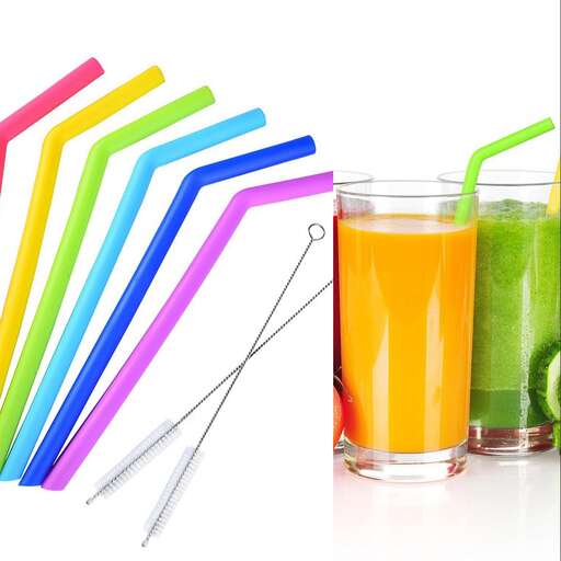 a glass of juice and a straw