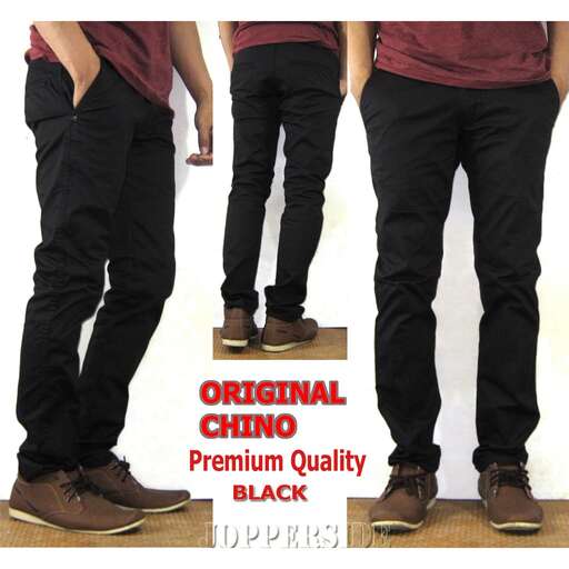 a pair of black jeans with brown shoes.