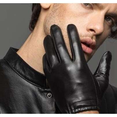 a man in a leather glove holding his hand.