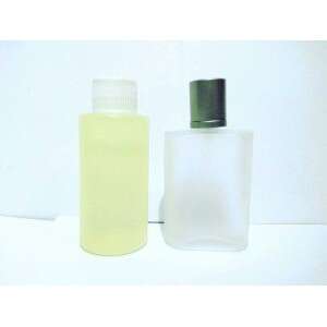 a bottle of soap sitting on top of a white surface.