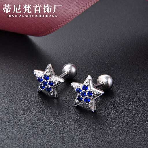 a pair of earrings with blue sapphires and diamonds.