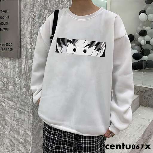 a white sweater with a black and white design.