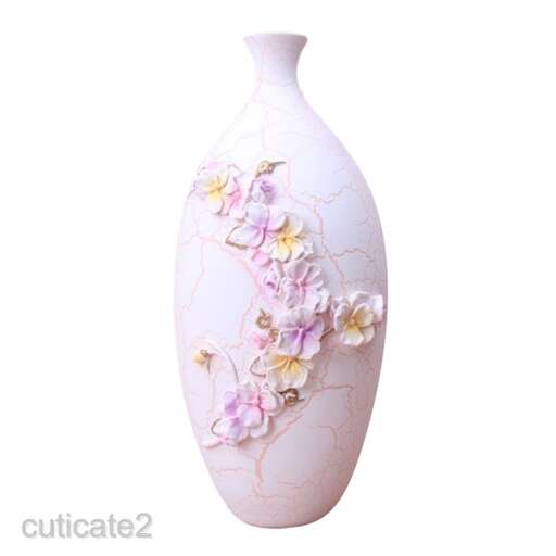a vase with a floral design on it.