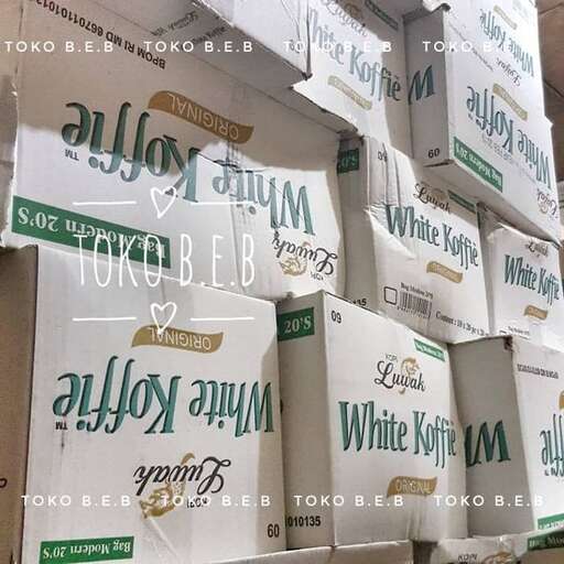 a large stack of boxes of white and green boxes.