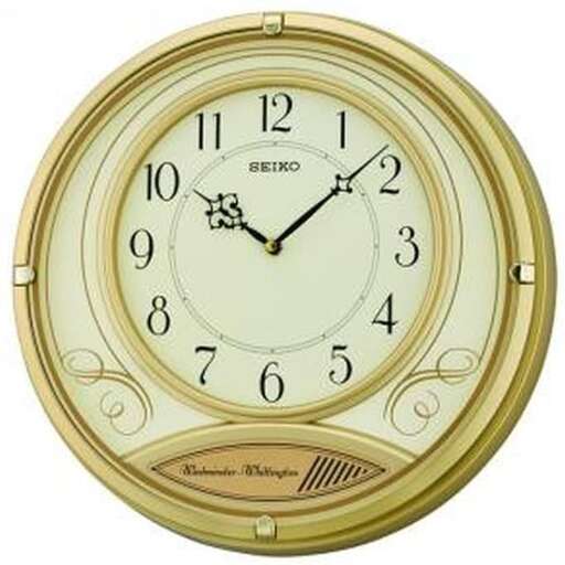 a clock with a gold face and a black face.