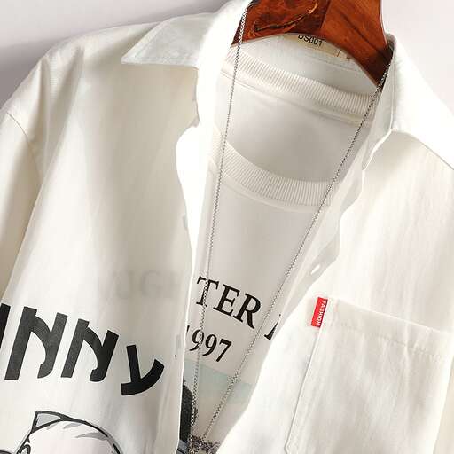 a white shirt with a red tag on the front and a brown wooden clip on the front.