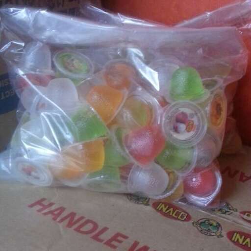 a bag of candy sitting on top of a box.