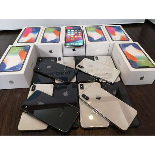 a table topped with different types of iphones.