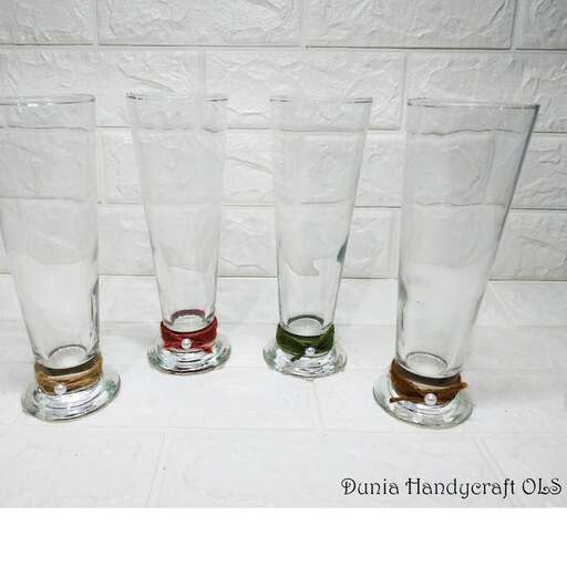 three empty glasses are sitting on a table.