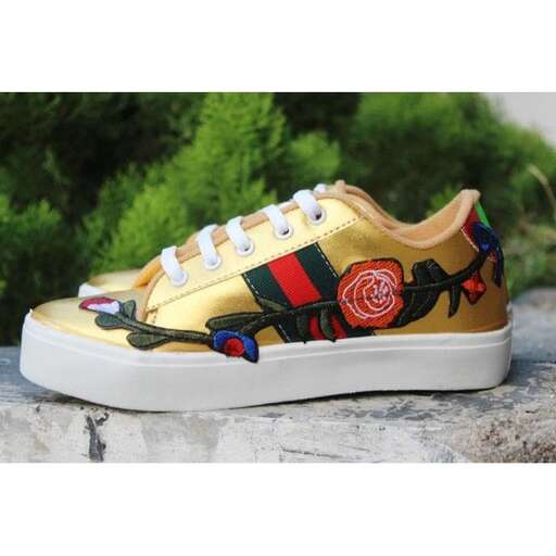 a pair of shoes with a floral design.