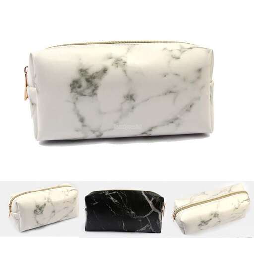 a white and black purse with a black and white marbled interior.