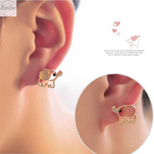 a pair of earrings with a cat on the ear