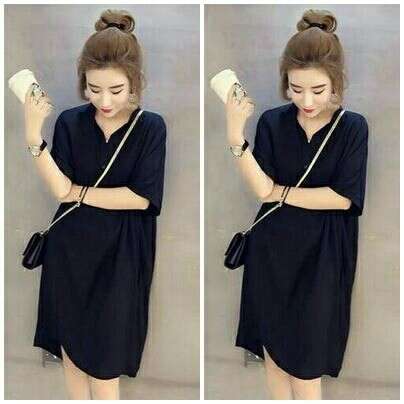 a black dress with a white handbag