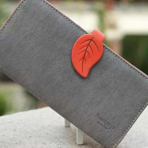 a leather wallet with a red heart on it.