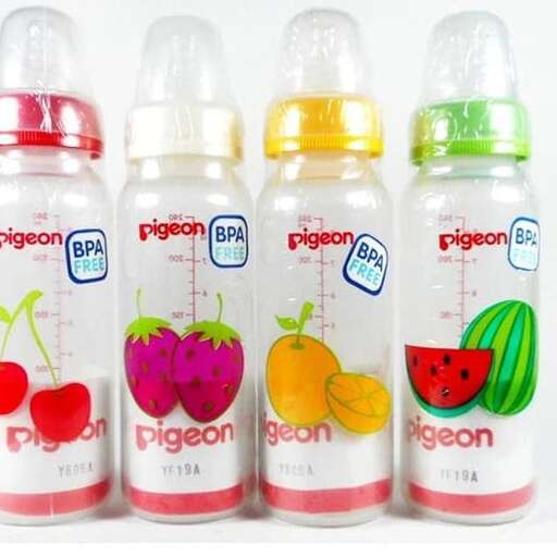 a bottle of fruit juice with a plastic straw on the side.