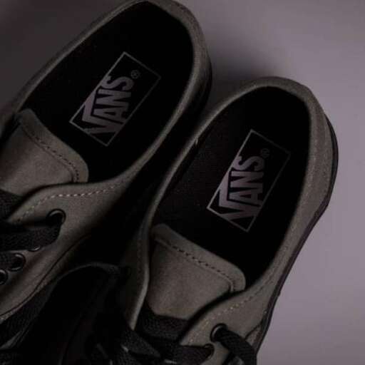 a pair of shoes with a logo on the side.