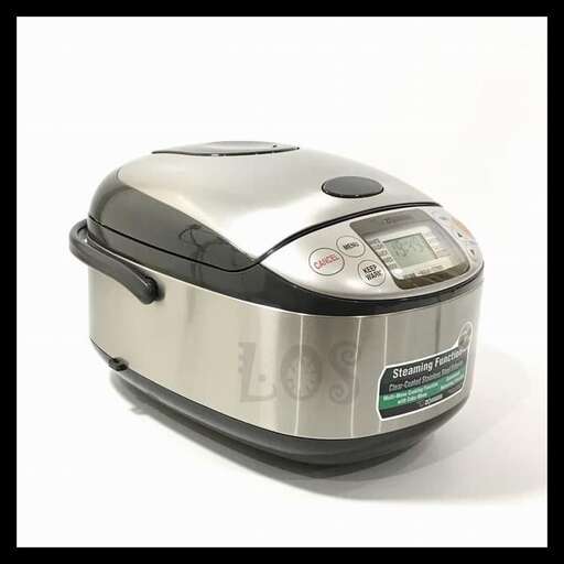 a silver toaster sitting on a white surface.