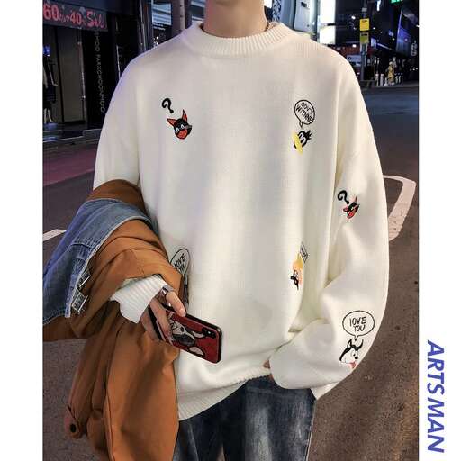a white sweater with a hoodie and jeans.