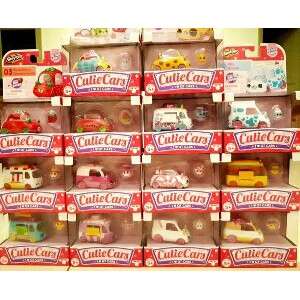 a collection of toy cars in a box