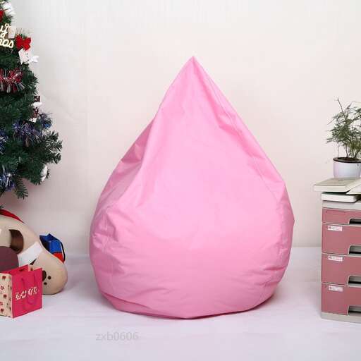 a pink pillow sitting on a white table.