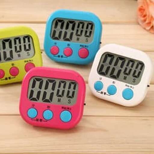 three colorful clocks with numbers on them.