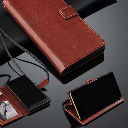 a leather wallet with a leather strap and a white earbud
