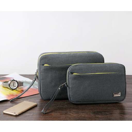 a small pouch with a watch on top of it.