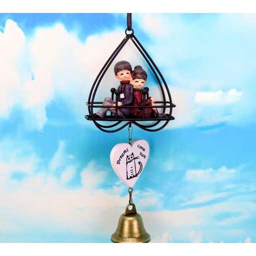 a little boy and a girl in a birdcage