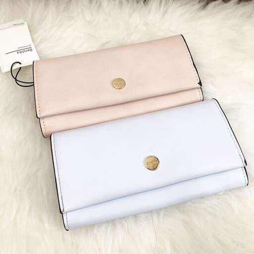a close up of two different types of handbags.
