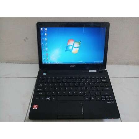 a black laptop computer sitting on top of a white table.