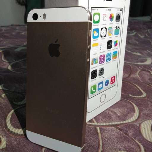 a white iphone box with a gold finish.