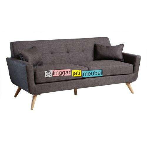 a couch with a large pillow on top of it.