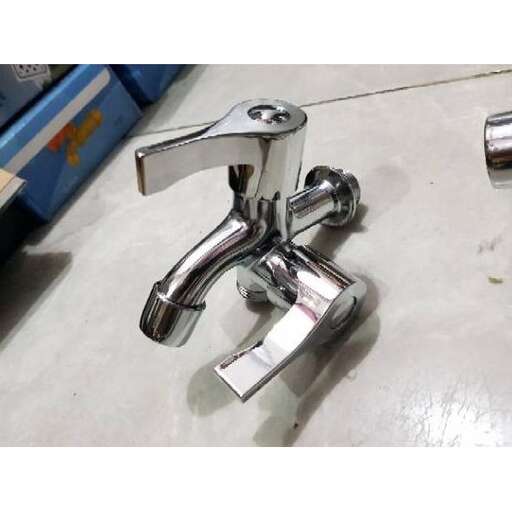 a chrome faucet with a handle.