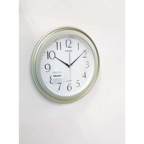 a clock that is on a wall.