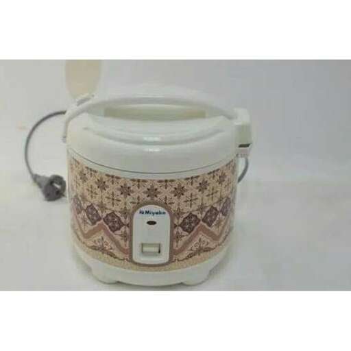 a small teapot with a remote control in it.